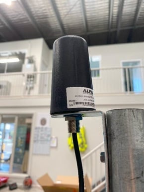 A black cylindrical object with a black cord

AI-generated content may be incorrect.