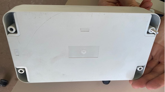 A person holding a white box

AI-generated content may be incorrect.