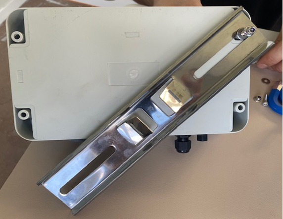 A metal object with screws

AI-generated content may be incorrect.