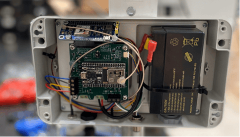 A circuit board inside a metal box

AI-generated content may be incorrect.